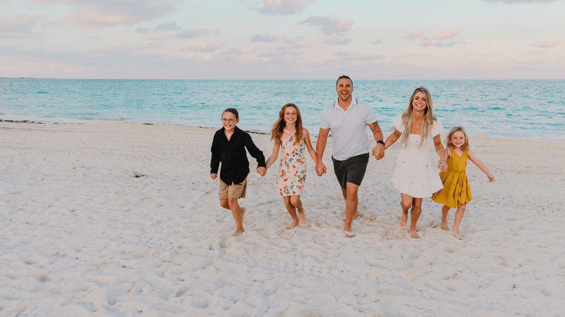 Family playing on caribbean beach, photo session