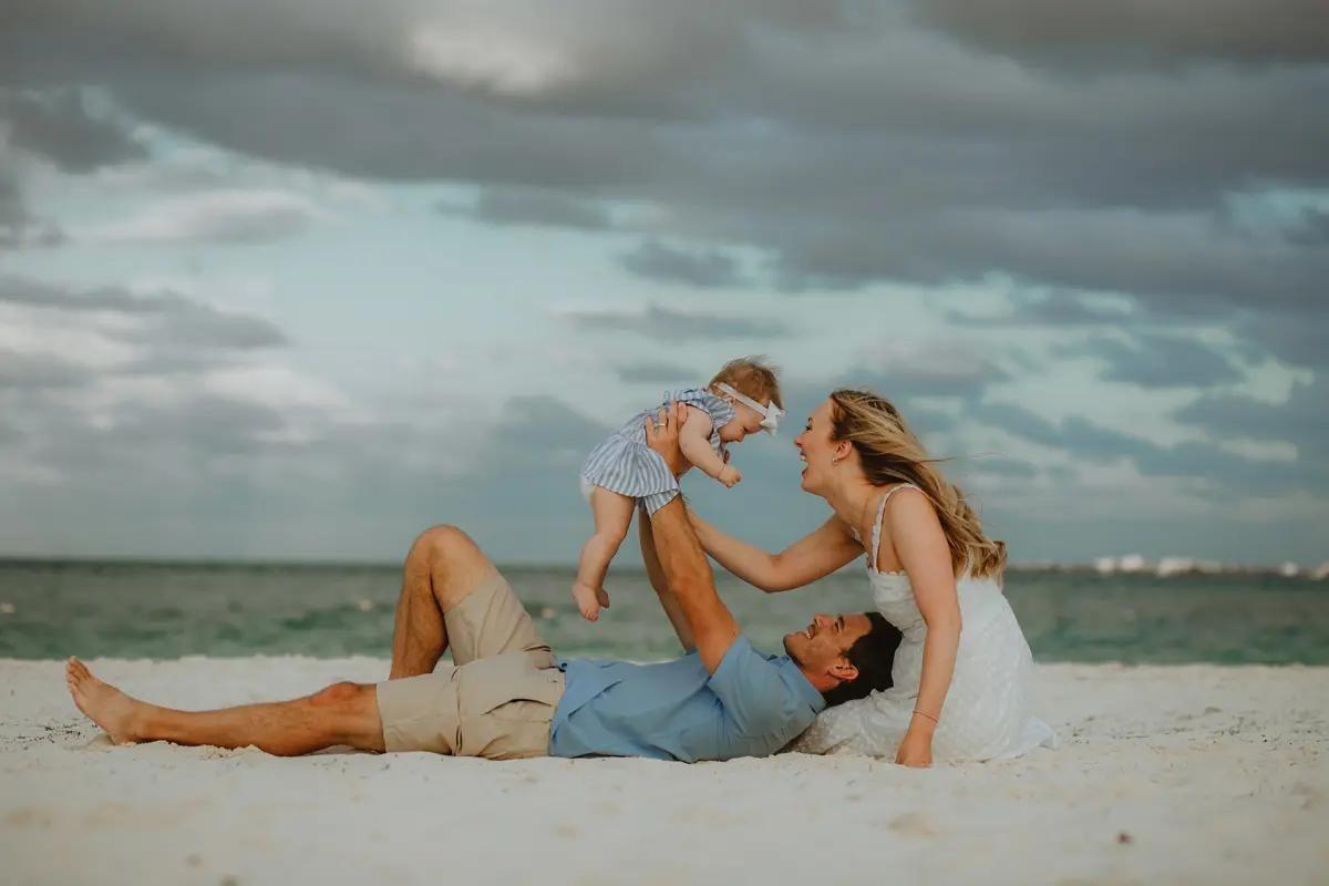 Family playing on caribbean beach, photo session